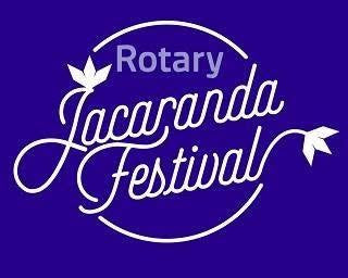 White Rotary Jacaranda Festival logo on a solid purple background.
