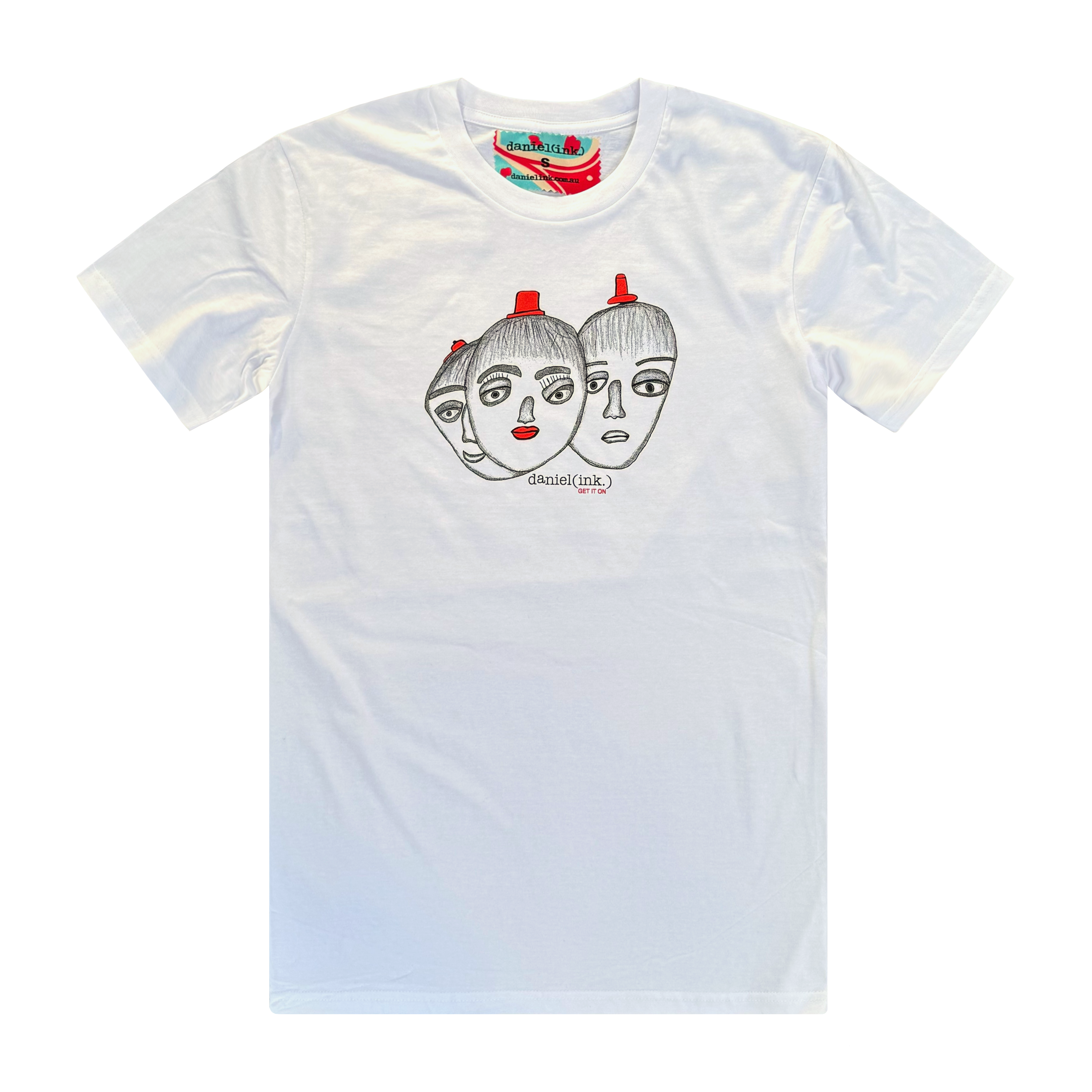 Men's white t-shirt featuring a hand drawn sketch of three faces merged together. The three faces have red hats and the face in the middle has red lips. This t-shirt has a red, white, and blue fabric label on the back of the neck.