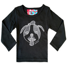 Black long sleeve babies’ shirt featuring a hand drawn sketch of a dog’s face in white. The dog has a round head, floppy ears, wide eyes, and its tongue is sticking out. There is also a red, white, and blue fabric label on the back of the neck. 