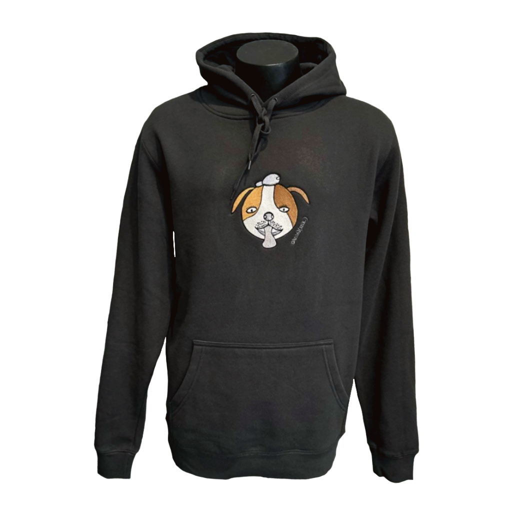 Unisex coal hoodie featuring an embroidered image of a dog’s face in brown and white. The hoodie features a pullover hood, inset sleeves, and a kangaroo pocket. The embroidered image of a dog's face has a round head, floppy ears, wide eyes, and its tongue is sticking out. The name daniel(ink.) is embroidered in silver thread next to the dog's face. 